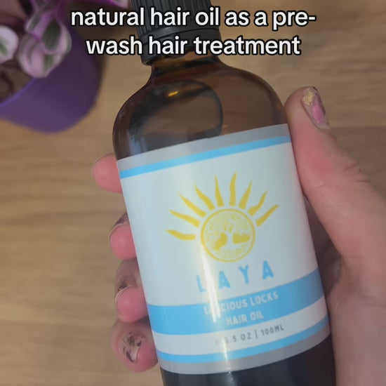 Video featuring 100% natural Luscious Locks Hair Oil being applied to hair, showcasing its nourishing properties for smooth, shiny hair and promoting hair growth.