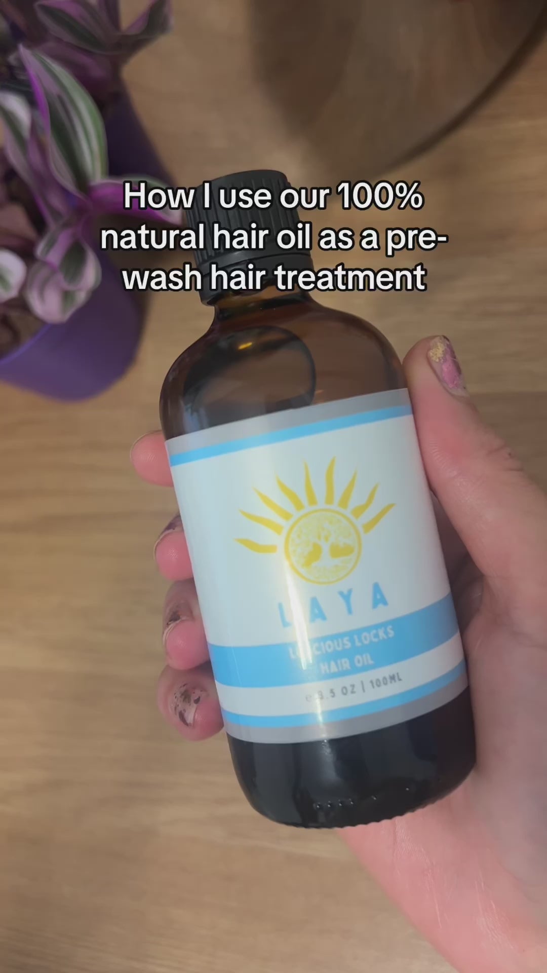 Video featuring 100% natural Luscious Locks Hair Oil being applied to hair, showcasing its nourishing properties for smooth, shiny hair and promoting hair growth.